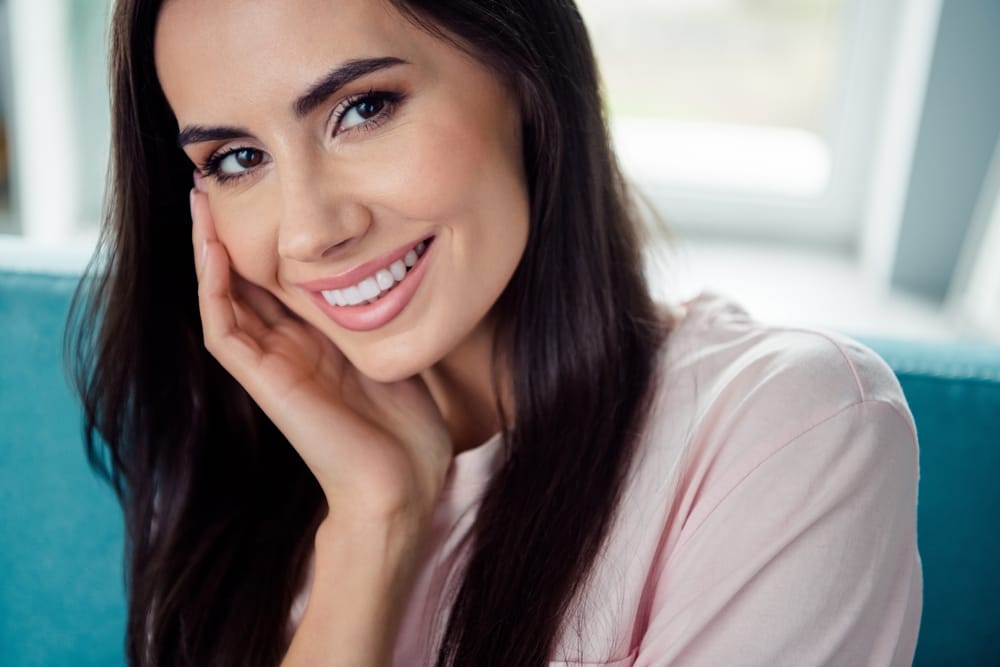 Confident woman with radiant skin and soft smile – Dermal Fillers Kirkland Close-up of a woman with smooth, glowing skin and natural beauty results after - Dermal Fillers Kirkland