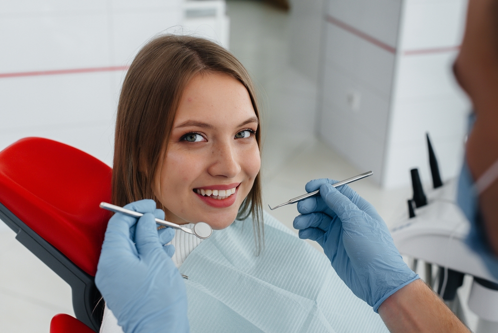 a dentist treating a patient in Kirkland, WA