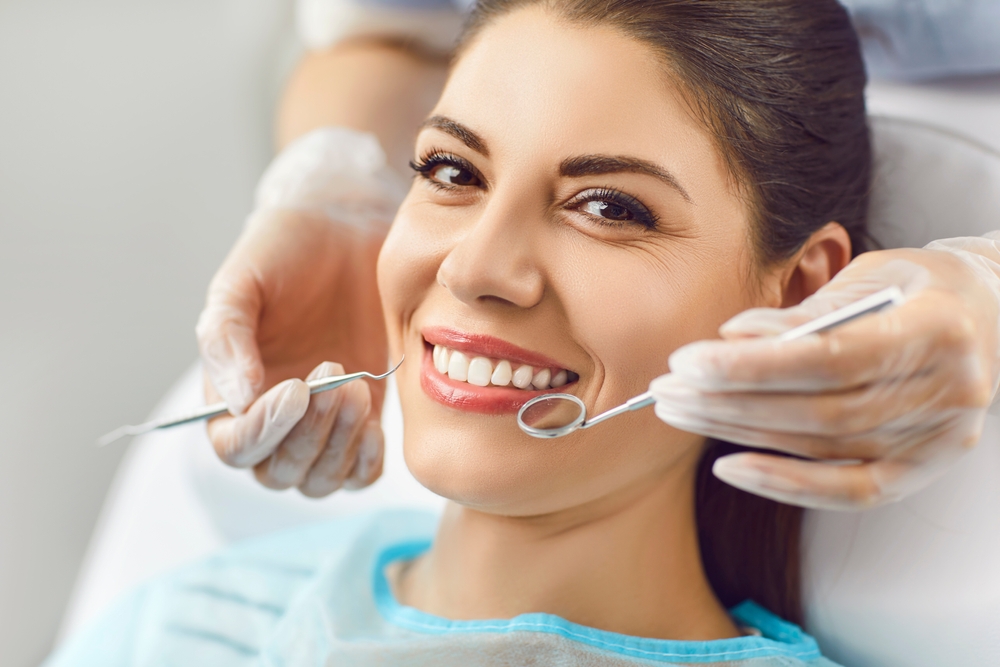 a dentist treating a patient in Kirkland, WA