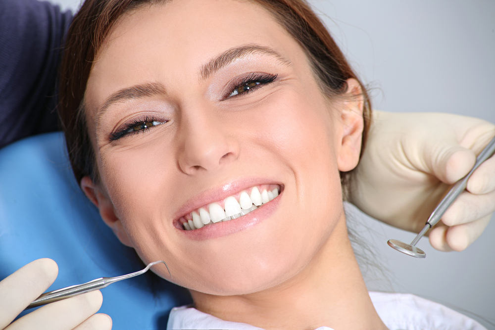 a dentist treating a patient in Kirkland, WA